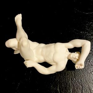 Nude porcelain posing man